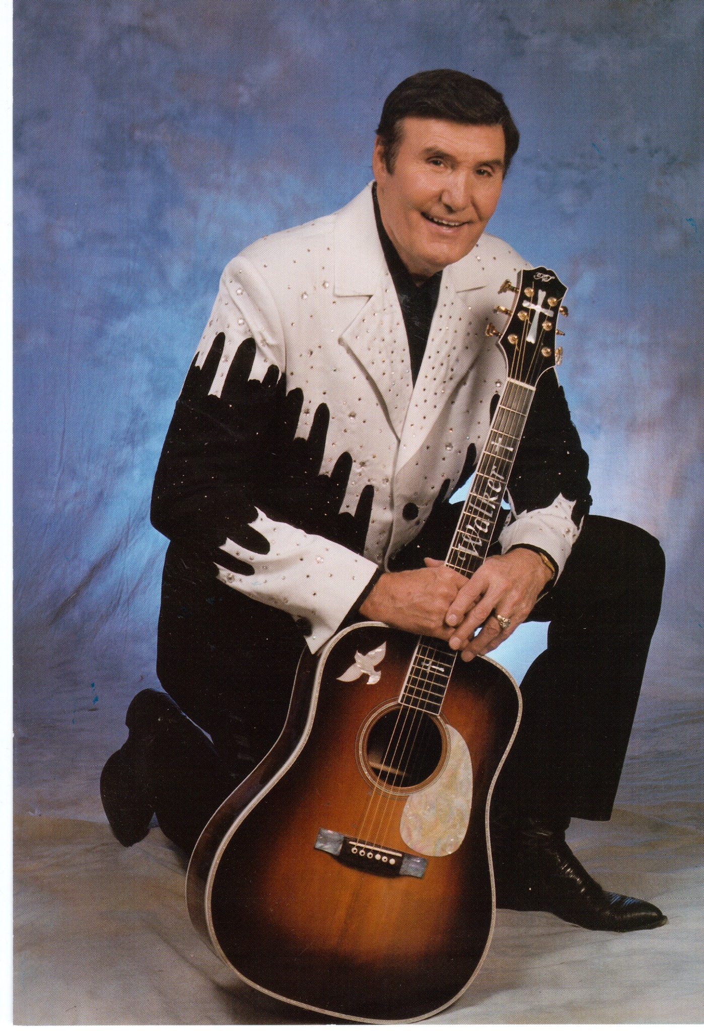 Billy Walker posing with his acoustic guitar